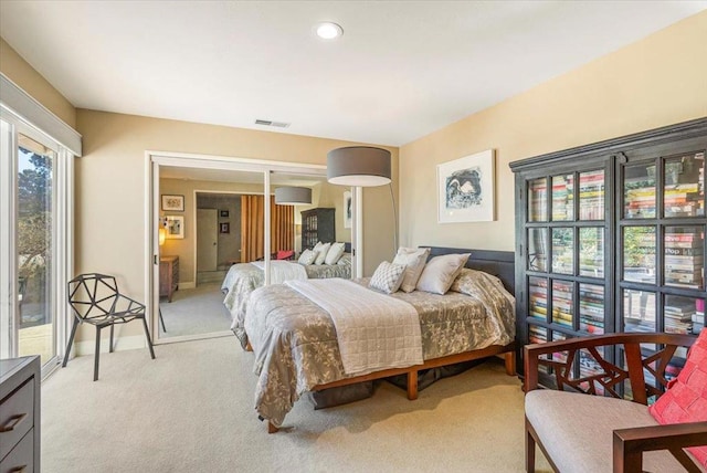 bedroom featuring light carpet