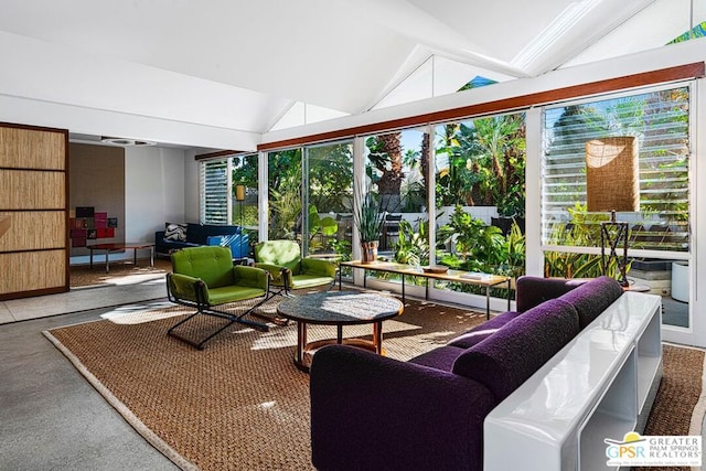 sunroom / solarium featuring vaulted ceiling