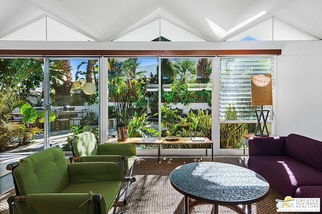 sunroom featuring vaulted ceiling