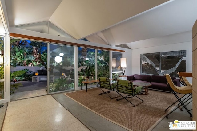 sunroom featuring lofted ceiling