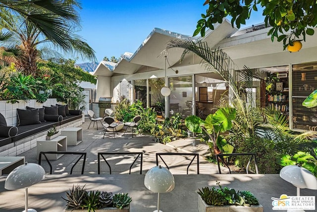 view of patio featuring area for grilling and outdoor lounge area