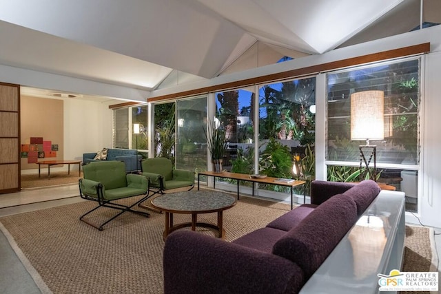 sunroom featuring lofted ceiling