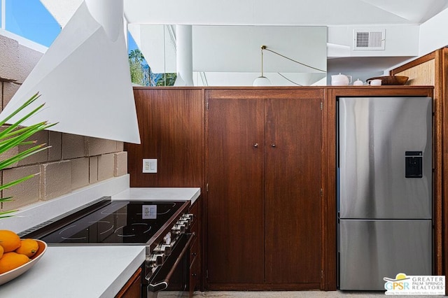 kitchen with extractor fan and stainless steel appliances