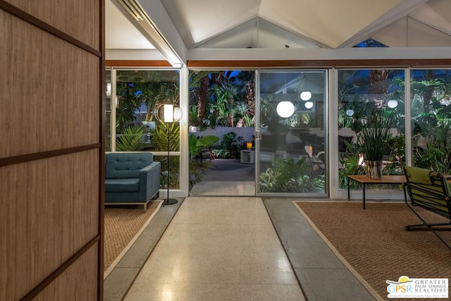 entryway featuring wooden walls