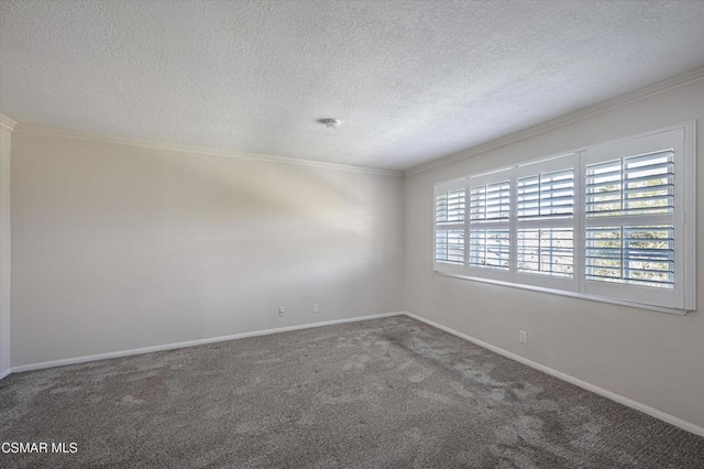 carpeted spare room featuring ornamental molding and a textured ceiling