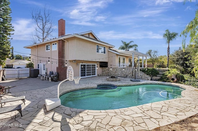 view of swimming pool featuring an outdoor fire pit, a patio area, and a pergola