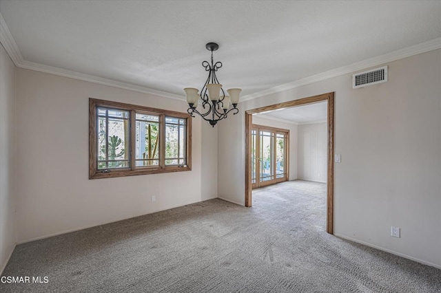 carpeted spare room with crown molding and a chandelier