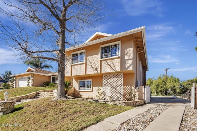 view of front of house with a front lawn and a garage