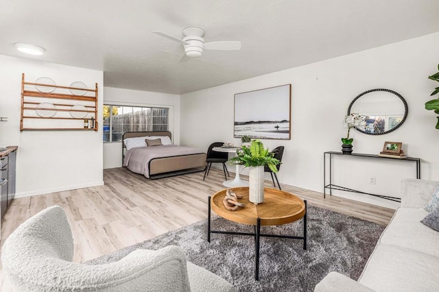 bedroom featuring ceiling fan and light hardwood / wood-style floors