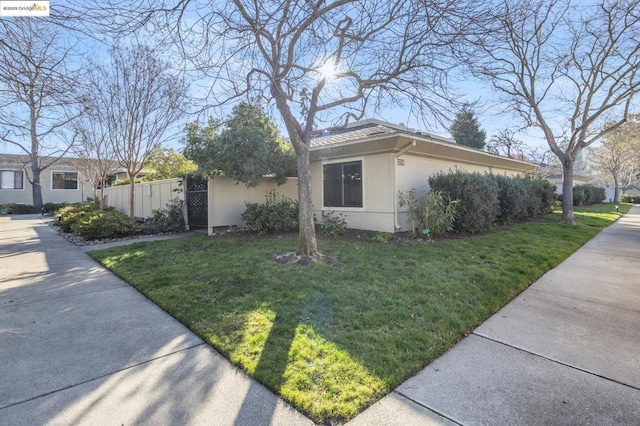 view of home's exterior with a yard