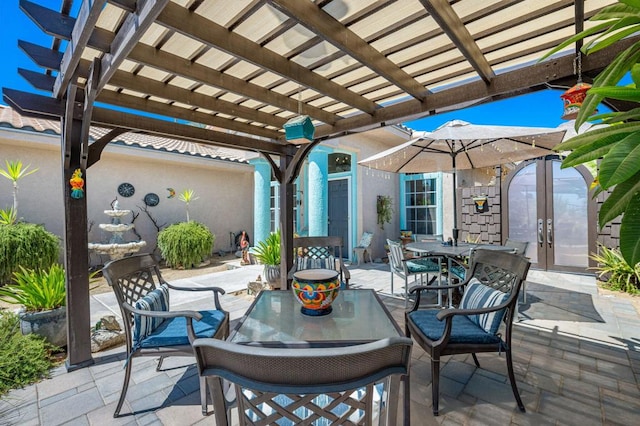 view of patio / terrace with a pergola and french doors