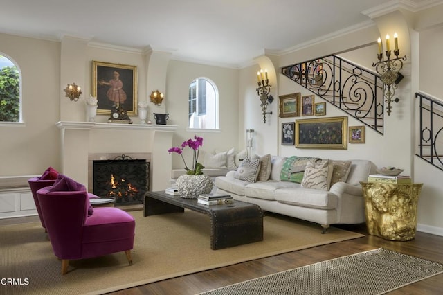 living room featuring ornamental molding, a wealth of natural light, and dark hardwood / wood-style floors