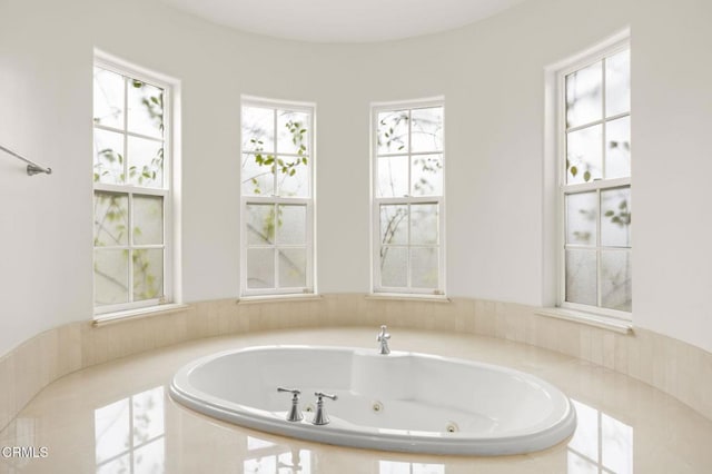 bathroom with tiled bath