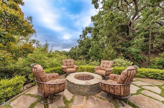 view of patio / terrace with a fire pit