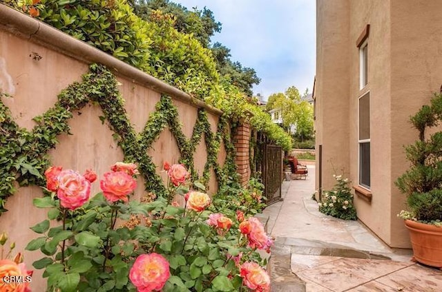 view of property exterior with a patio