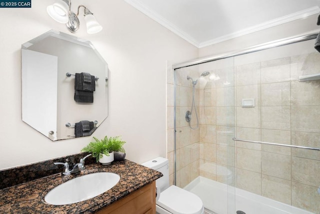 bathroom with vanity, toilet, crown molding, and walk in shower