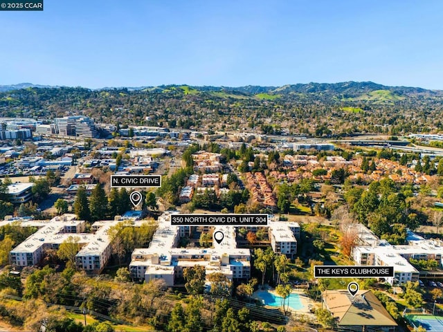 birds eye view of property with a mountain view