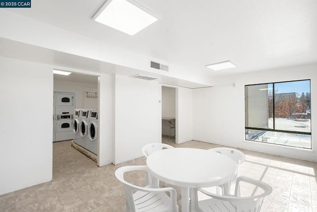 interior space with washer and dryer and stacked washer and clothes dryer