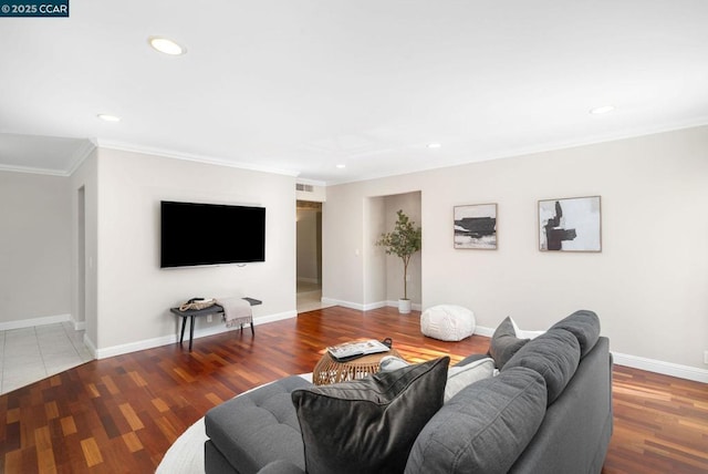 living room with hardwood / wood-style floors and ornamental molding