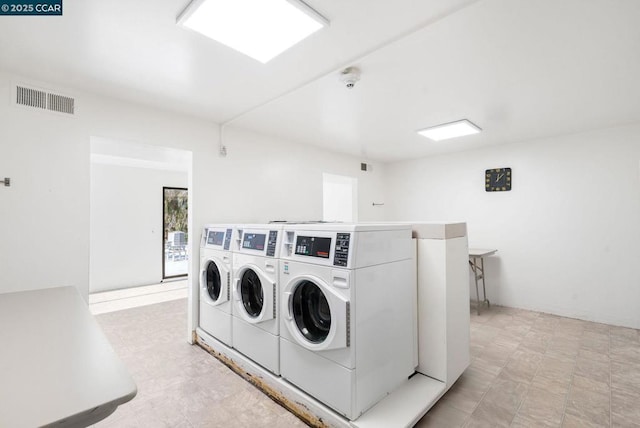 washroom with washer and clothes dryer