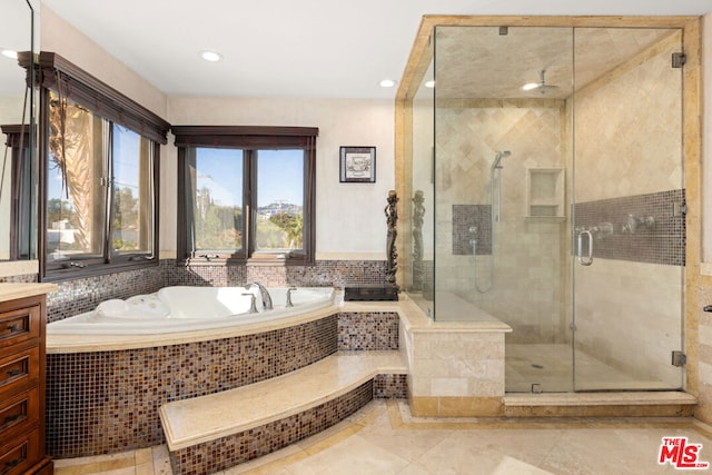 bathroom featuring vanity, tile patterned floors, and independent shower and bath