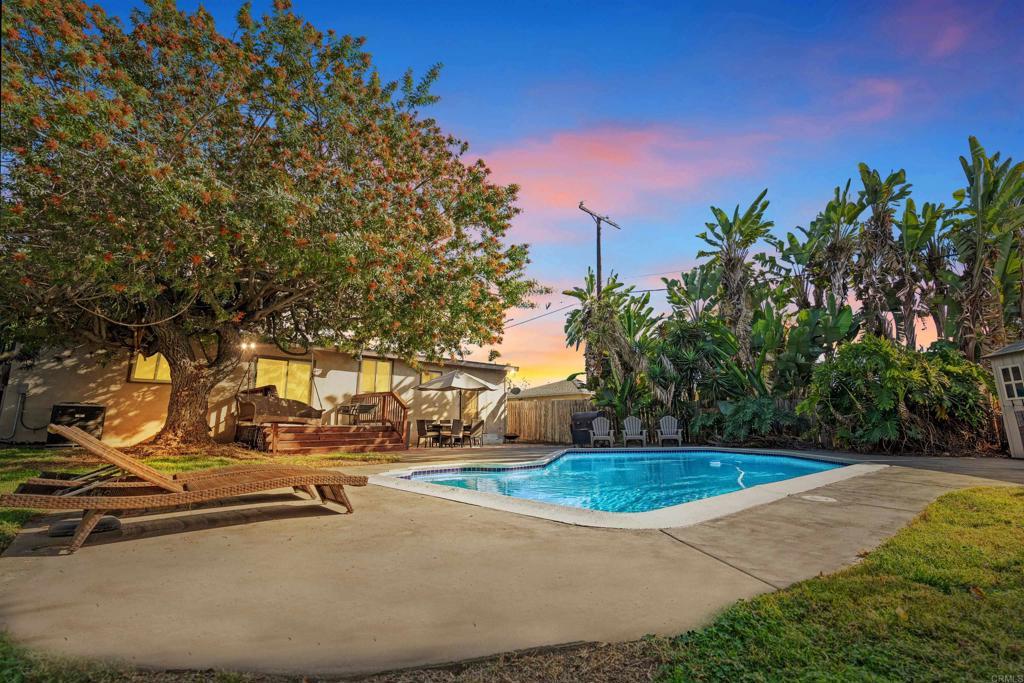 pool at dusk featuring a patio area