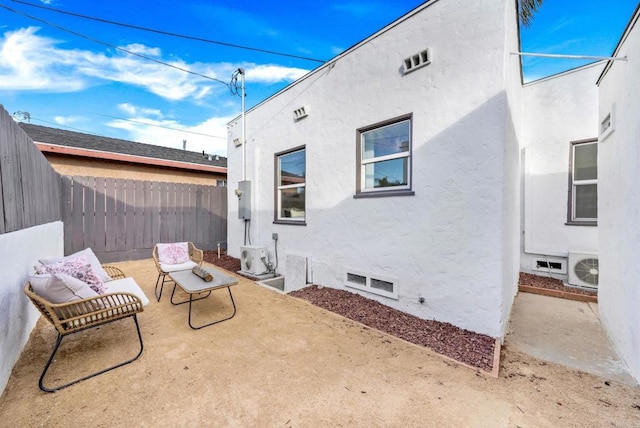 view of patio featuring ac unit