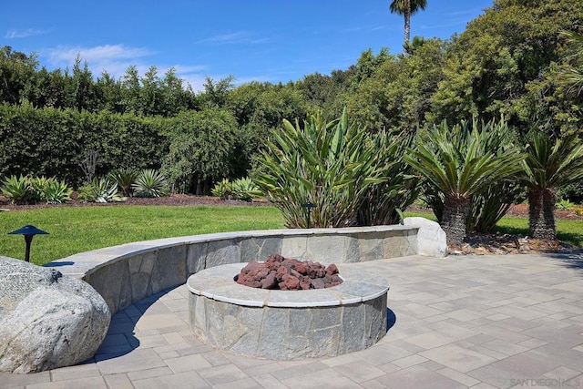 view of patio / terrace with an outdoor fire pit