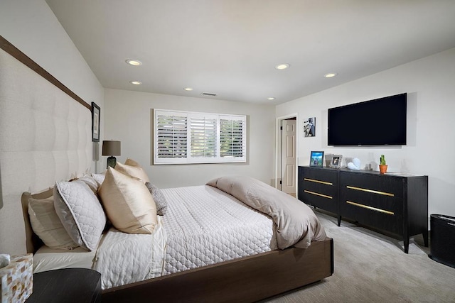 bedroom featuring light carpet