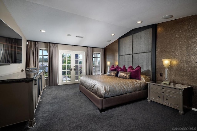 carpeted bedroom with access to outside, french doors, and vaulted ceiling