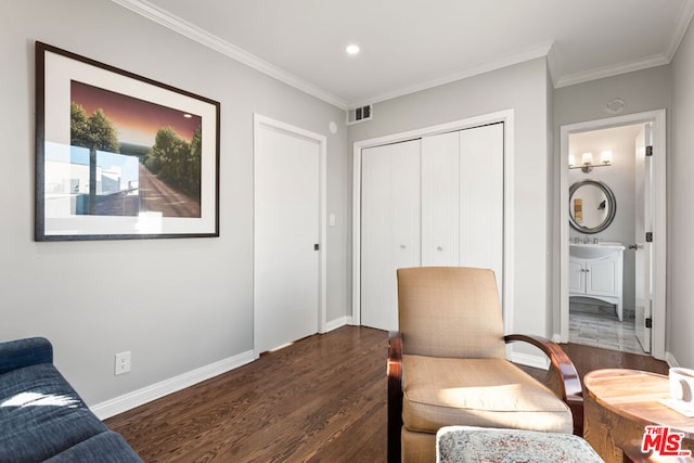 sitting room featuring sink, dark hardwood / wood-style flooring, and ornamental molding