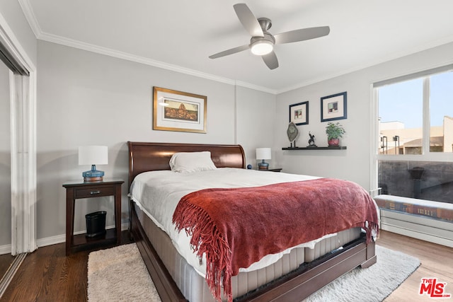 bedroom with ceiling fan, crown molding, and dark hardwood / wood-style floors