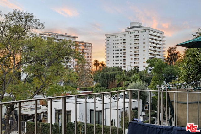 view of balcony at dusk