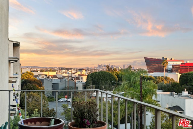 view of balcony at dusk