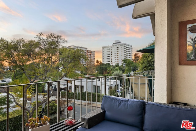 view of balcony at dusk