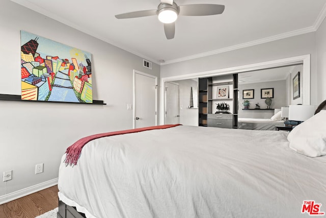 bedroom with ceiling fan, hardwood / wood-style flooring, and ornamental molding