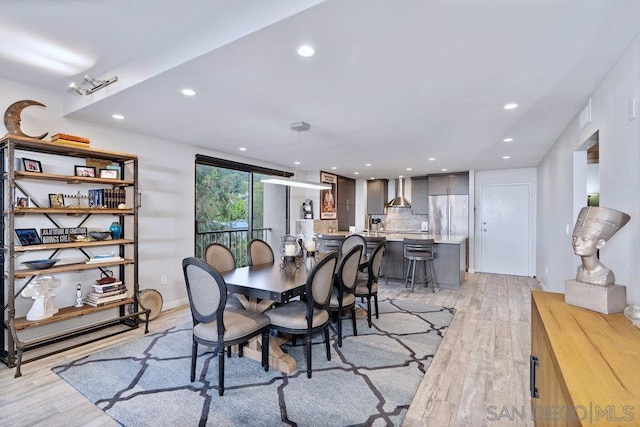 dining room featuring light hardwood / wood-style flooring