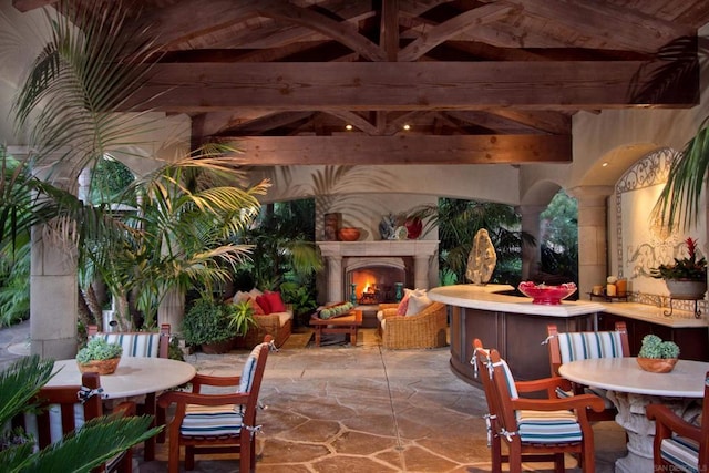 exterior space featuring a gazebo and an outdoor fireplace