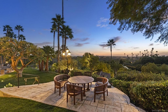 patio terrace at dusk with a lawn