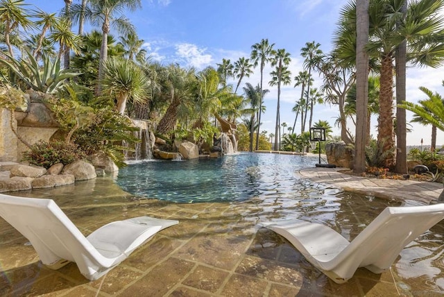 view of swimming pool featuring pool water feature