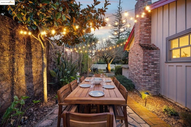 view of patio terrace at dusk