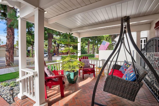 view of patio featuring a porch