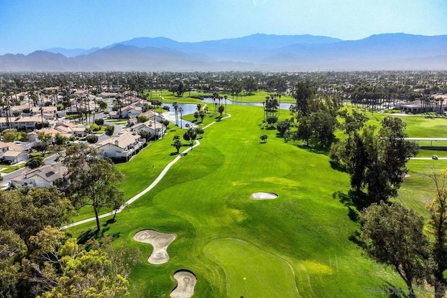 birds eye view of property with a water and mountain view