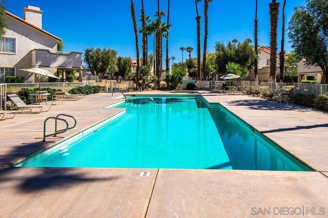 view of swimming pool featuring a patio area