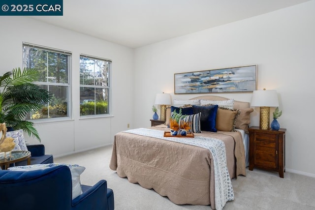 bedroom featuring light colored carpet