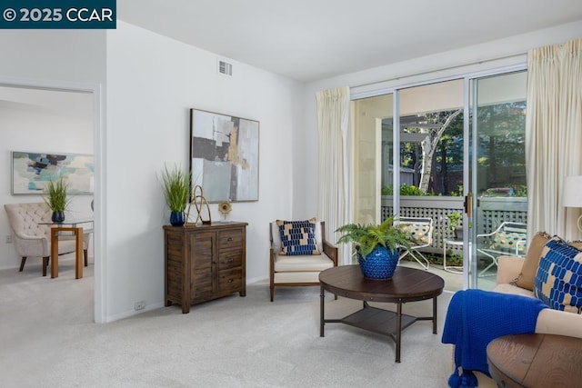 living area with light colored carpet