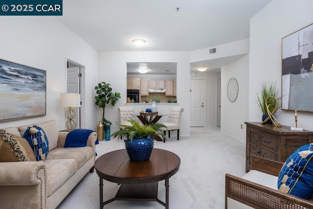 living room with light colored carpet