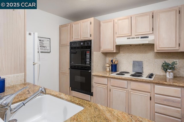 kitchen featuring sink, black double oven, decorative backsplash, light brown cabinetry, and white cooktop