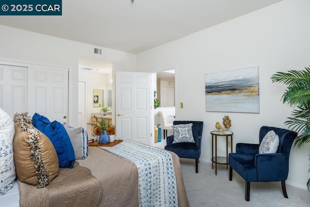 carpeted bedroom featuring a closet