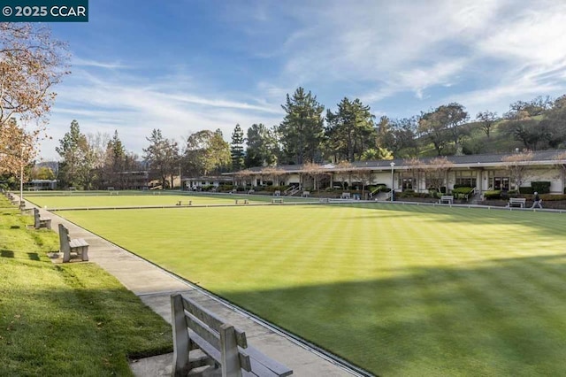 view of property's community with a lawn